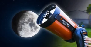 A person using a Celestron NexStar telescope to observe the moon. Telescopes use magnification to make distant objects appear larger and more detailed